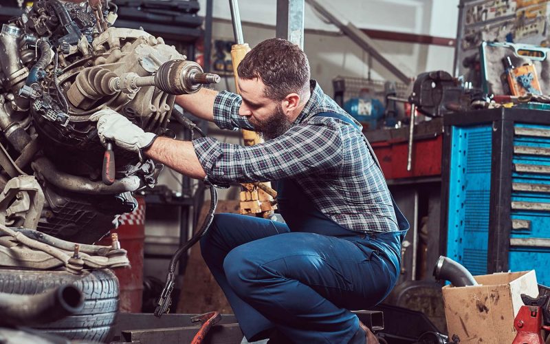 brutal-tattooed-mechanic-repairs-the-car-engine-in-small.jpg